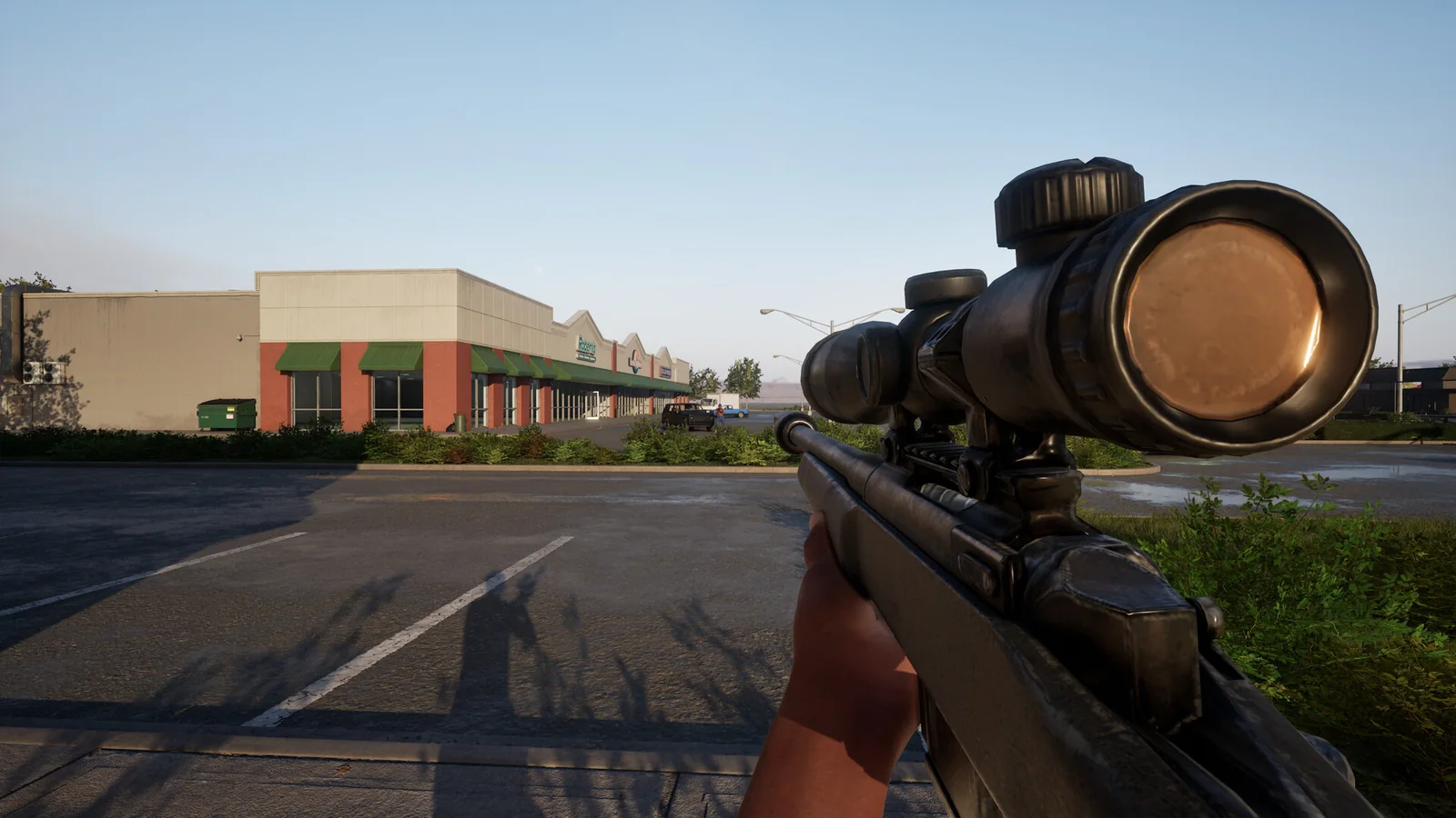 Hood Warfare 2 scoped rifle overlooking a parking lot and a row of retail storefronts.